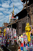 Chiang Mai - The Wat Phan Tao temple, southern side wall of the Wihan, also visible the Chedi. 